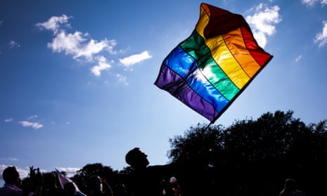 People parade wave a rainbow coloured flag during WorldPride in Copenhagen, Denmark.
