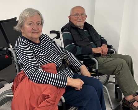 Maria and Czeslaw Krupa sitting in wheelchairs