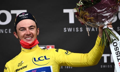 Quick-Step Alpha Vinyl Team's Belgian rider Yves Lampaert celebrates with the overall leader's yellow jersey on the podium after stage one of the 109th edition of the Tour de France