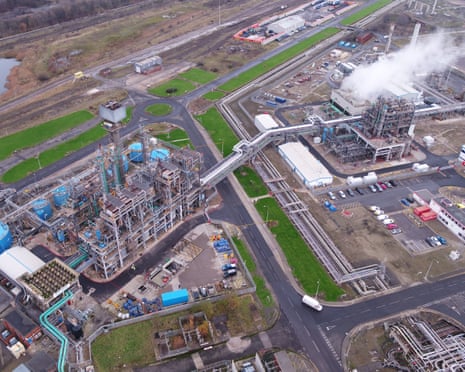 Aerial view of Huntsman Polyurethanes' chemical plant, where smoke billows from chimneys in one area.