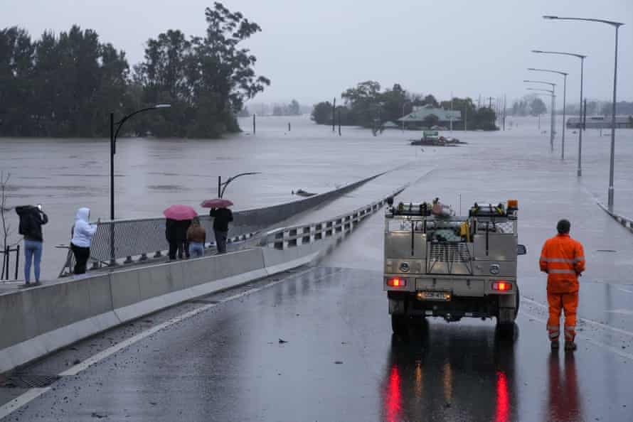 An emergency vehicle blocks access to the flooded Windsor bridge on the outskirts of Sydney on Monday.
