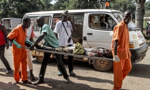 A wounded man is carried into the hospital in Bangui