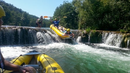 inflatable kayak comes over the rapids in Croatia