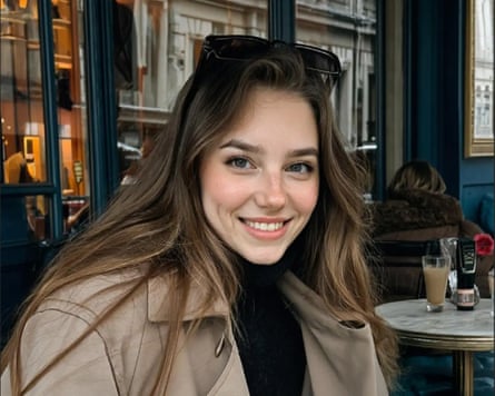 An AI generated woman sat outside a cafe.