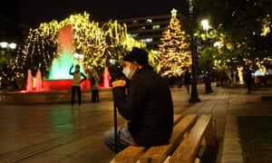 Coronavirus live news: London enters tier 3 restrictions; Trump will 'absolutely' encourage vaccine use | World news 6 People walk at central Syntagma square that is decorated for Christmas in Athens, Greece, 15 December 2020.