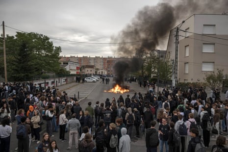 Protesters and high-school students take part in a demonstration outside the Lycee Toulouse Lautrec, in Toulouse on 12 OCtober 2026.
