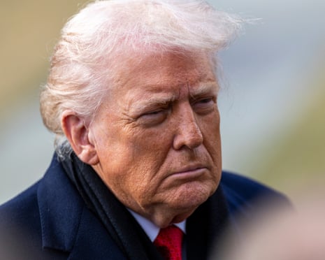 Donald Trump responds to questions from the press as he walks to board Marine One on the South Lawn of the White House, 16 January 2026.