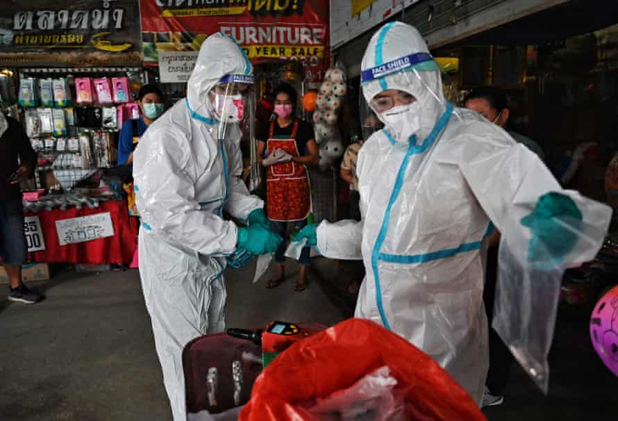 Agency photographer of the year – 2021 shortlist | World news 32 A research team from Chulalongkorn Universitys chemistry department collecting sweat samples from vendors in a fresh market as they develop a novel device that detects the Covid-19 coronavirus through specific odors, in Bangkok
