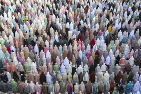 Muslims attend Eid al-Adha prayer at the Dian al-Mahri Mosque, also known as Golden Dome Mosque, in Depok, West Java, Indonesia