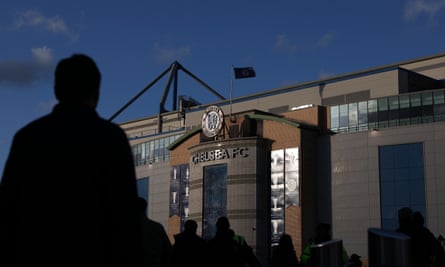 Silhouettes of fans outside the stadium prior to the Premier League match between Chelsea and Everton