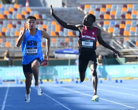 Gout Gout waves to the crowd while winning the under-20 100m final at the 2026 Australian Athletics Junior Championships