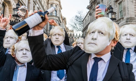 A group of men dressed as Boris Johnson stage a mock lockdown party protest outside Downing Street on 14 January.