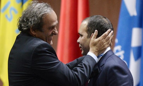 Prince Ali bin al-Hussein, right, is embraced by Uefa President Michel Platini, left, after al-Hussein announced his withdrawal in the Fifa president election.