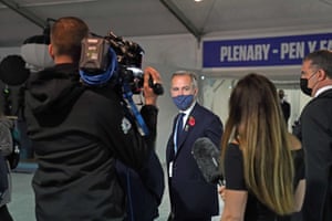 Mark Carney, a former Bank of England governor who is now the prime minister’s finance adviser for Cop26, speaks to a TV crew at the summit.