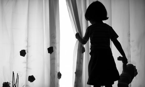 Silhouette of little girl with doll