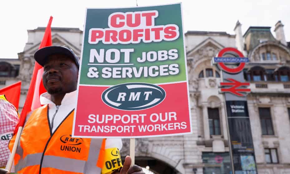 An RMT union member pickets outside Victoria Station, on the first day of national rail strike, in London, 21 June 2022.