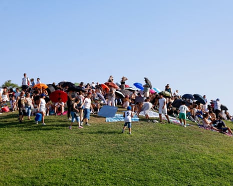 General view of people preparing to watch the solar eclipse in Madrid, Spain.