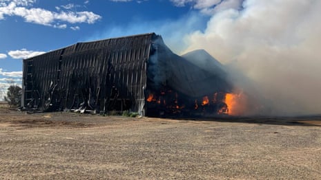 A hay shed on fire