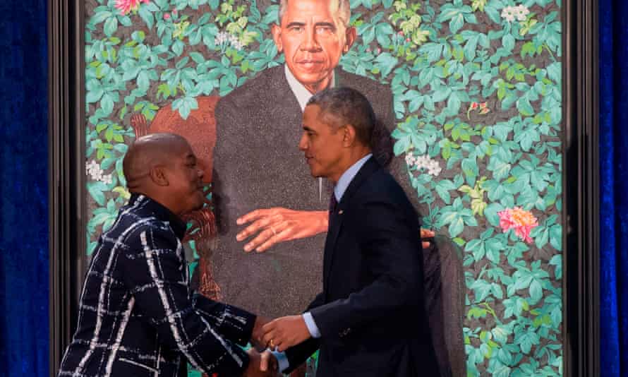 President Barack Obama shakes hands with Kehinde Wiley, at the unveiling of his portrait in Washington, DC, in February 2018.