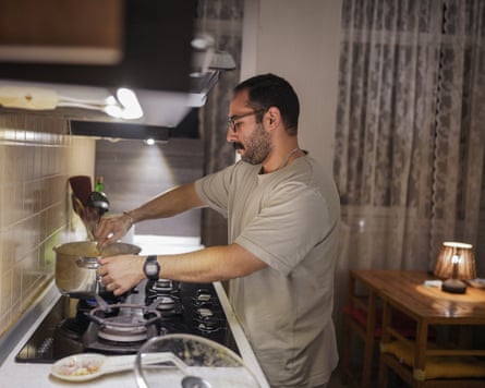 Farhad, 33, preparing dinner to share with friends
