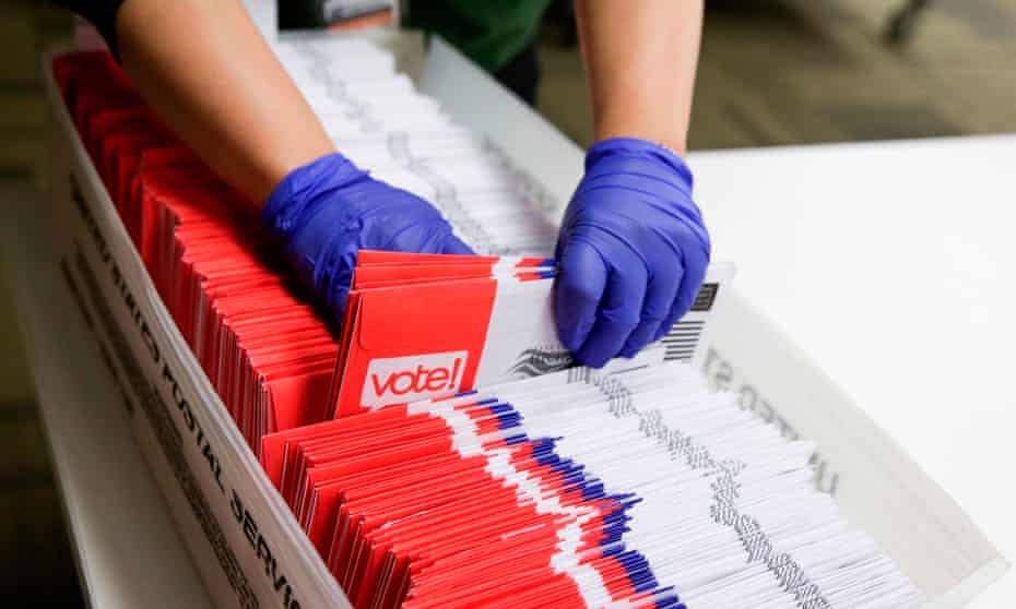 Election workers sort vote-by-mail ballots for the presidential primary at in Renton, Washington, on Tuesday. Many who voted early will have cast their ballots for candidates no longer in the race.