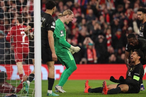 Marquinhos and Matvey Safonov celebrate making a combined save and block in PSG’s win at Anfield