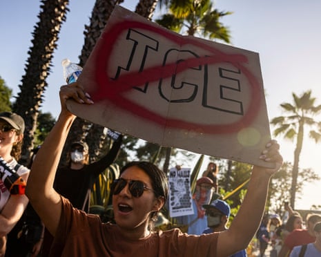 person holds up sign in protest