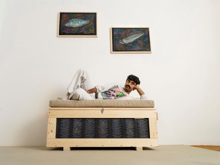 Mohammed Z Rahman with his crate and fish pictures.