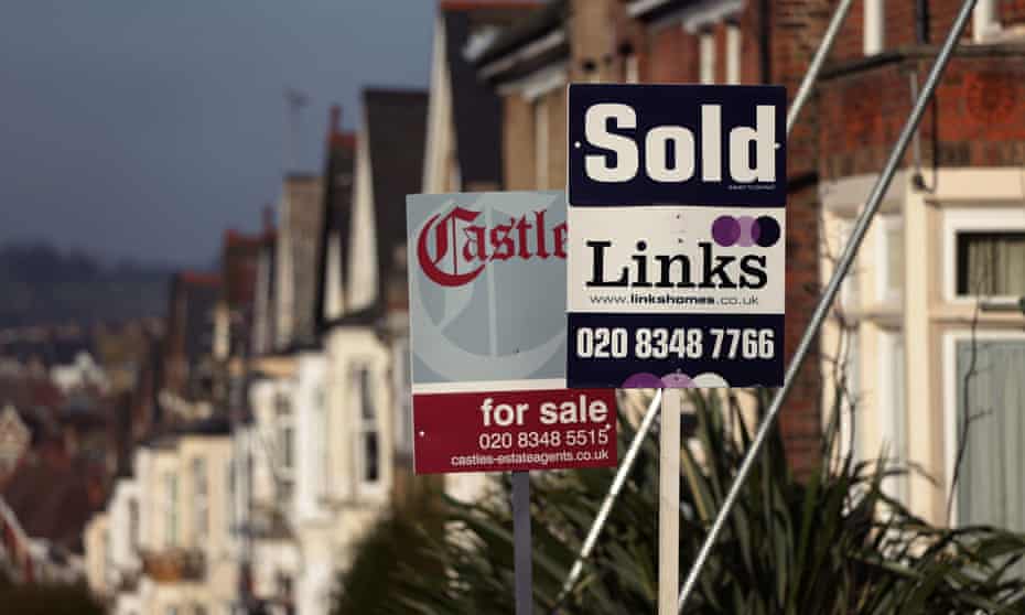 a row of for sale sign across a housing terrace