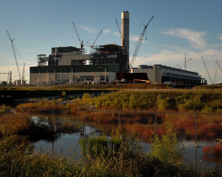 a building with watery grass in front