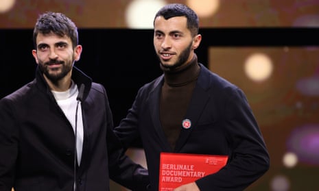 Basel Adra and Yuval Abraham on stage after winning Berlinale documentary award