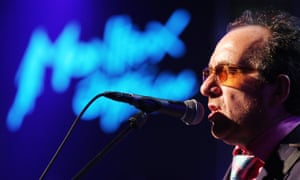 Elvis Costello belts out a song in July 2005, when he was still basking in the warm glow of Liverpool being crowned European champions.