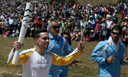 Olympic flame first torch bearer, Greek gymnast Eleftherios Petrounias.