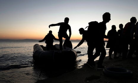 Syrians arrive in a dinghy on Kos island, Greece. at night