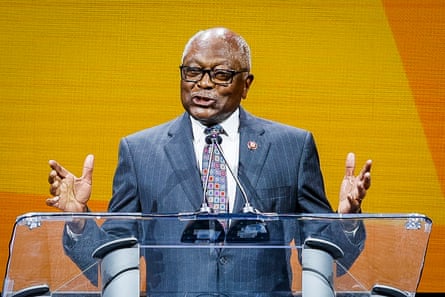 A man speaking in front of microphones
