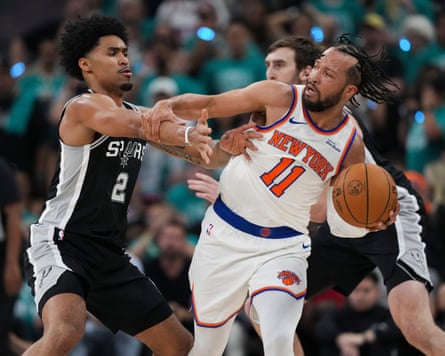Jalen Brunson fends off Dylan Harper as he leads his team to victory in Game 1 of the NBA finals