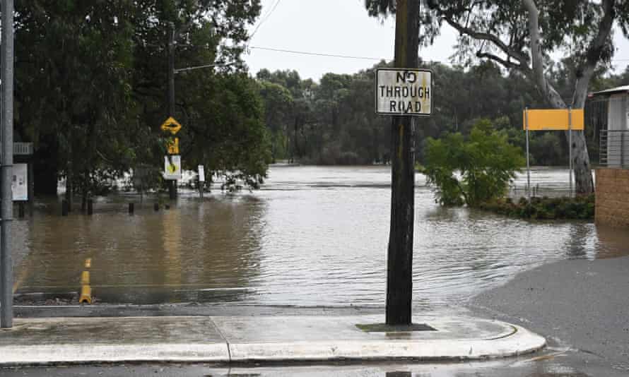 Australia news live: major flooding hits north-west Sydney; nation passes 10,000 Covid deaths | Australia news