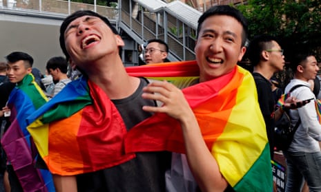 Supporters of same-sex marriage celebrate outside parliament in Taipei.