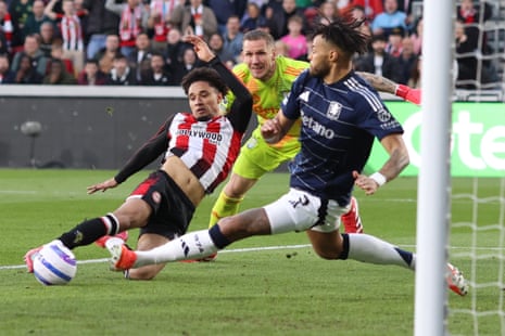 Tyrone Mings of Aston Villa blocks a shot from Brentford's Kevin Schade