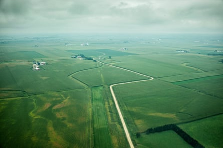An arial view of the Iowan countryside: crop fields stretch out for as far as the eye can see
