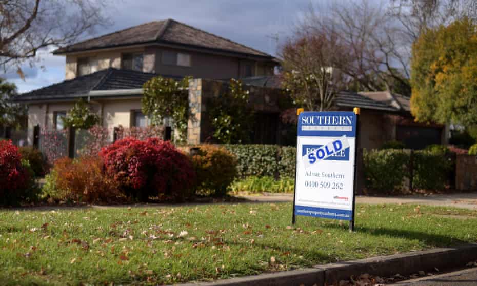A sale sign is seen in front of a house in Canberra