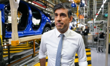 Rishi Sunak stands next to a production line at the Nissan car plant in Sunderland.