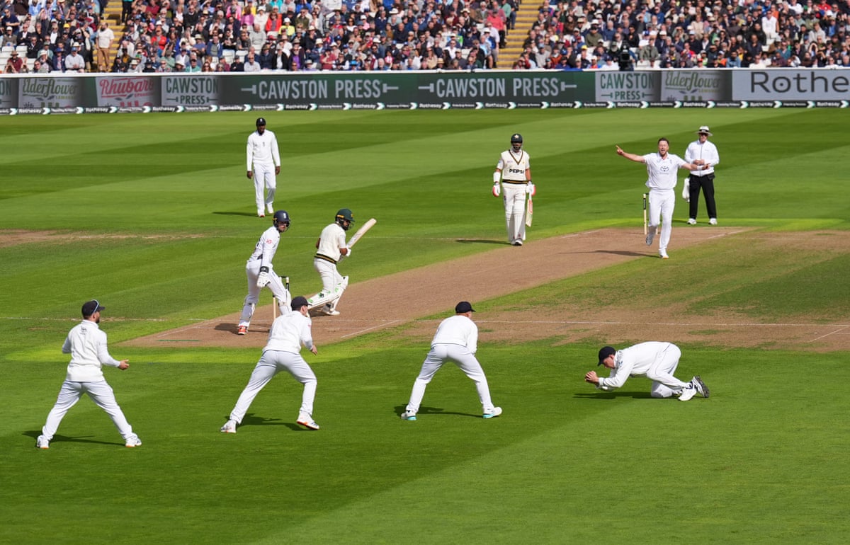 England’s Ollie Robinson celebrates the wicket of Pakistan’s Abdullah Shafique, caught by Dan Lawrence in the slips
