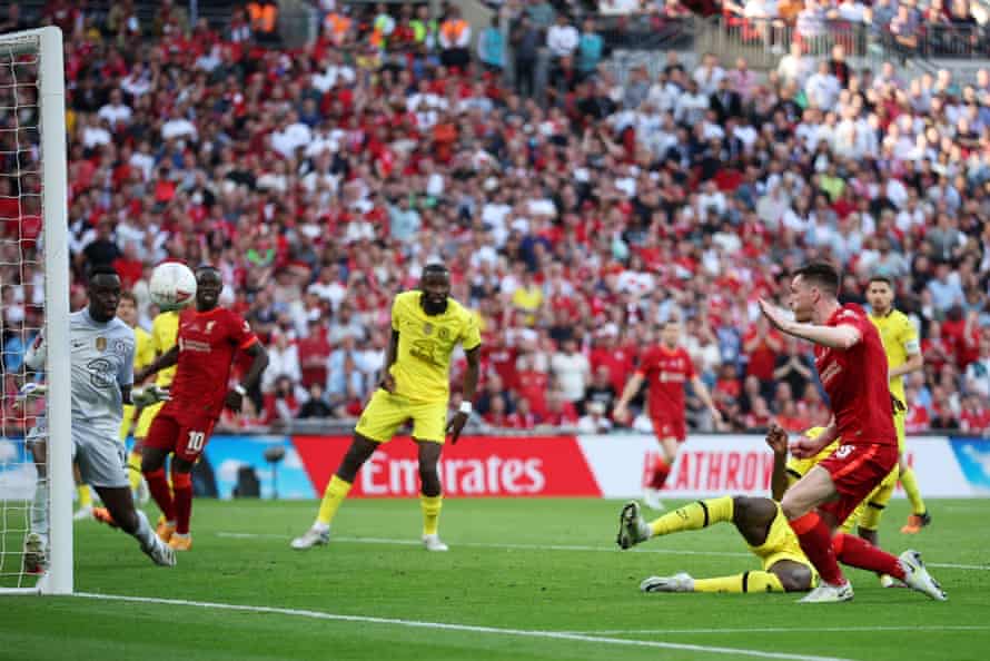 Andrew Robertson of Liverpool shoots and hits the post.