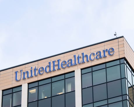 a sign on a building reads 'UnitedHealthcare' a sign on a building reads 'UnitedHealthcare'