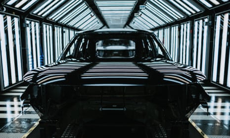 A car in a light tunnel, used for final inspection of the chassis