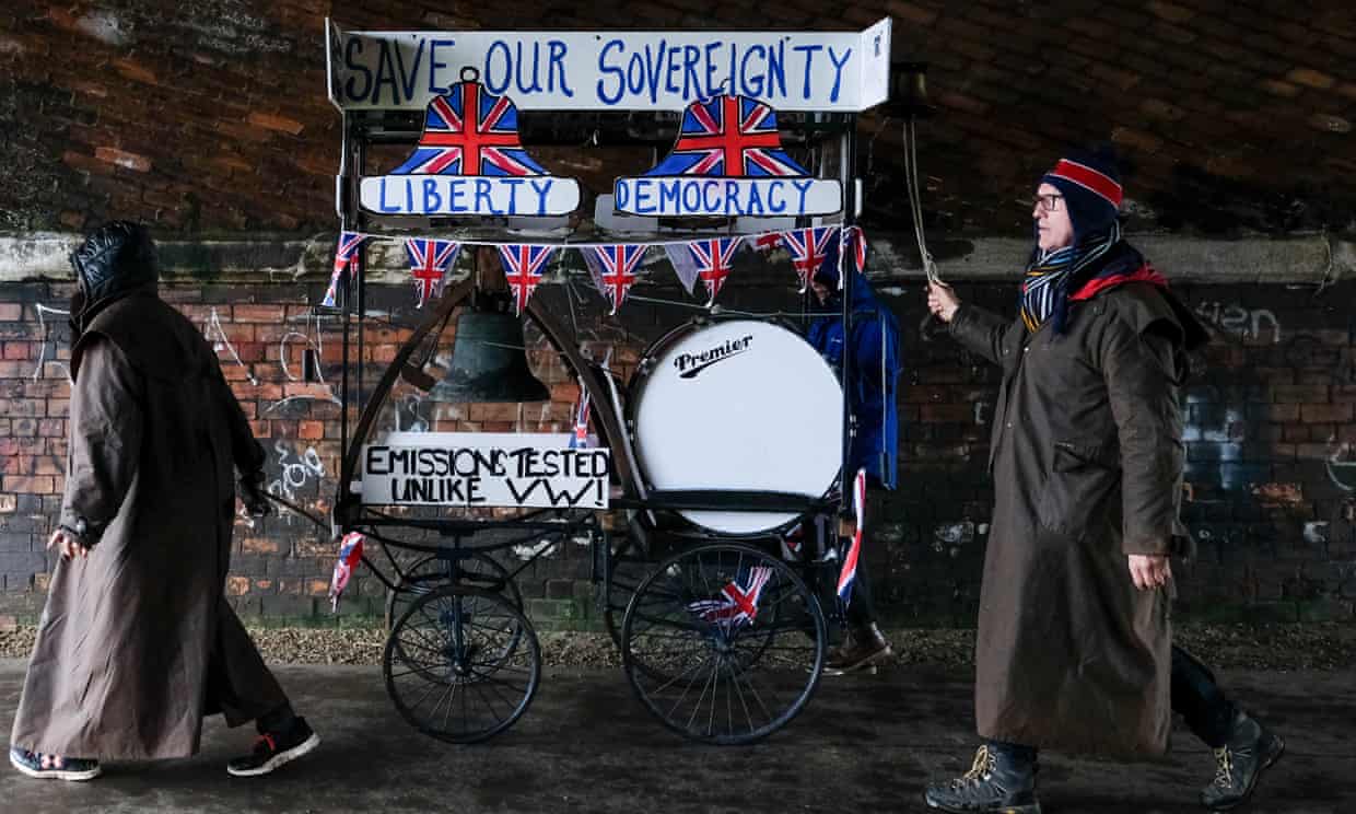 A couple push a Save Our Sovereignty trolley through a tunnel during the first leg of the March to Leave.