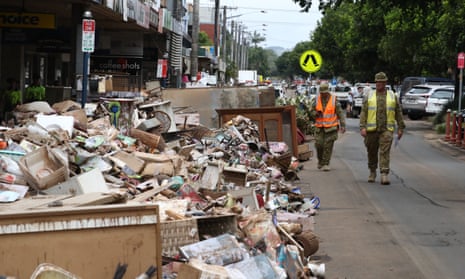 Rubbish piled high in the streets of Lismore after flooding