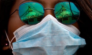 A young girl attends a mass prayer for coronavirus victims at the Boudhha stupa in Kathmandu, Nepal.