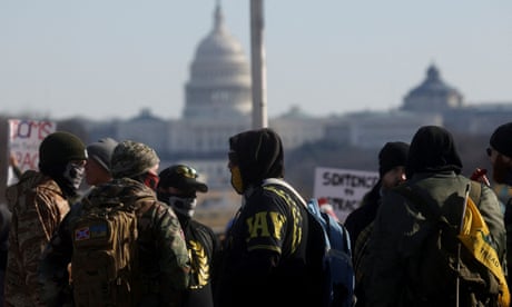 A group of people dressed in colors and symbols associated with the group Proud Boys, on the National Mall in Washington, 23 January 2022.
